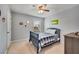 Traditional bedroom with natural light, ceiling fan and soft carpet at 4080 Huron Dr, Cumming, GA 30028