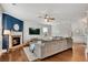 Inviting living room with a stone fireplace, modern decor, and hardwood floors at 4080 Huron Dr, Cumming, GA 30028