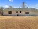 View of the house with a large backyard featuring a double door entry, and good natural lighting at 51 Lost Meadows Dr, Dallas, GA 30157