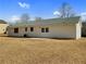 Spacious backyard with patio area, offering ample outdoor space and privacy at 51 Lost Meadows Dr, Dallas, GA 30157