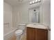 Clean bathroom with tub-shower, vanity with wood cabinets, and ceramic flooring at 51 Lost Meadows Dr, Dallas, GA 30157