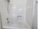 The bathtub is an all-white acrylic style with chrome shower head and faucet hardware at 51 Lost Meadows Dr, Dallas, GA 30157