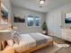 Serene bedroom with a large window, neutral decor, and wood-look flooring for a modern touch at 51 Lost Meadows Dr, Dallas, GA 30157