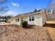 Side view of home with a covered front porch and mature landscaping at 51 Lost Meadows Dr, Dallas, GA 30157