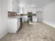 Well-lit kitchen boasts white cabinets, stainless steel appliances, and a modern design at 51 Lost Meadows Dr, Dallas, GA 30157
