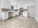 Bright kitchen features white cabinets, stainless steel appliances, and stylish backsplash at 51 Lost Meadows Dr, Dallas, GA 30157