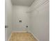 Functional laundry room with overhead shelving, flooring, and washer connections at 51 Lost Meadows Dr, Dallas, GA 30157
