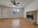 Bright living room featuring a stone fireplace and sleek, hard-surface flooring at 51 Lost Meadows Dr, Dallas, GA 30157