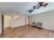 Spacious living room with hardwood floors, neutral walls, and modern ceiling fans at 6690 Bridge Brook Ovlk, Cumming, GA 30028