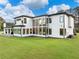 Modern home with large windows providing ample natural light and views of the surrounding landscape at 2940 Old Peachtree Rd, Dacula, GA 30019