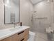 Elegant bathroom with a glass-enclosed shower, floating vanity, and modern fixtures, creating a spa-like atmosphere at 2940 Old Peachtree Rd, Dacula, GA 30019