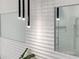 Elegant bathroom with sleek shower, modern fixtures, and stylish wall design at 2940 Old Peachtree Rd, Dacula, GA 30019