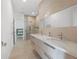 Spa bathroom with double sinks, white marble counters, and an amazing glass shower with rainfall head at 2940 Old Peachtree Rd, Dacula, GA 30019
