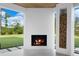 Outdoor fireplace and wood storage niche on a covered patio at 2940 Old Peachtree Rd, Dacula, GA 30019