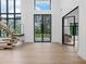 Grand foyer with high ceilings, modern staircase, and expansive windows for abundant natural light at 2940 Old Peachtree Rd, Dacula, GA 30019