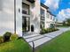 Modern home entrance featuring sleek black trim, contemporary lighting, and manicured landscaping at 2940 Old Peachtree Rd, Dacula, GA 30019