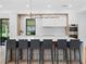 Bright kitchen with a center island and bar stool seating at 2940 Old Peachtree Rd, Dacula, GA 30019