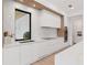 Bright, modern kitchen with marble countertops and a large window at 2940 Old Peachtree Rd, Dacula, GA 30019
