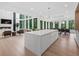 Expansive modern kitchen with large island, fireplace, and living area at 2940 Old Peachtree Rd, Dacula, GA 30019