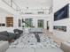Spacious living room featuring fireplace, staircase, and stylish furniture at 2940 Old Peachtree Rd, Dacula, GA 30019