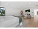 Spacious main bedroom with a fireplace, sitting area, large windows, and access to an ensuite bathroom at 2940 Old Peachtree Rd, Dacula, GA 30019