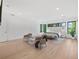 Bright bedroom with large windows, seating area, and a view of outdoor greenery at 2940 Old Peachtree Rd, Dacula, GA 30019