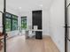 Modern home office with stylish desk, sleek design elements, and ample natural light at 2940 Old Peachtree Rd, Dacula, GA 30019