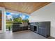Outdoor kitchen with modern cabinetry, grill, and countertop space at 2940 Old Peachtree Rd, Dacula, GA 30019