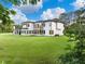 Lush backyard of a modern home, surrounded by trees, providing ample privacy at 2940 Old Peachtree Rd, Dacula, GA 30019