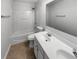 Clean bathroom featuring a double vanity, shower, and a large mirror at 2985 Whittier Way, Cumming, GA 30040