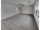 Expansive bedroom with plush carpeting, ceiling fan, and a bright window at 2985 Whittier Way, Cumming, GA 30040