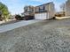 Well-maintained home with a two-car garage and a beautifully landscaped front yard at 2985 Whittier Way, Cumming, GA 30040