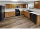 Updated kitchen featuring stainless steel appliances, wooden cabinets, and white countertops at 2985 Whittier Way, Cumming, GA 30040