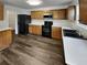 Well-equipped kitchen with updated appliances, ample counter space, and wood cabinets at 2985 Whittier Way, Cumming, GA 30040