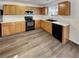 Well-lit kitchen features stainless steel appliances, ample cabinet space, and sleek countertops at 2985 Whittier Way, Cumming, GA 30040
