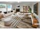 Bright living room boasts large windows, fireplace, and stylish furniture arrangement at 2985 Whittier Way, Cumming, GA 30040
