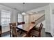 Bright dining room featuring hardwood floors, a pendant light, and stylish chair rail molding at 4825 Odum View Ln, Cumming, GA 30040