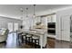 Spacious kitchen featuring a granite island, stainless appliances, and hardwood floors at 4825 Odum View Ln, Cumming, GA 30040