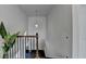 View of a bright staircase enhanced with a modern light fixture and green plant creating an inviting space at 4825 Odum View Ln, Cumming, GA 30040