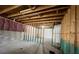 Unfinished basement with exposed wooden beams, concrete floor, and framed walls at 5928 Cobblestone Creek Cir, Mableton, GA 30126