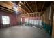 Spacious unfinished basement with framed walls, bare concrete floor, and a window at 5928 Cobblestone Creek Cir, Mableton, GA 30126