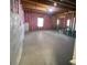Unfinished basement with exposed wooden beams, pink insulation, and bare concrete floor at 5928 Cobblestone Creek Cir, Mableton, GA 30126