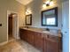 Bathroom with double vanity and granite countertop plus walk-in closet access at 5928 Cobblestone Creek Cir, Mableton, GA 30126