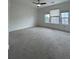 Spacious bedroom with neutral carpet, ceiling fan, and lots of natural light at 5928 Cobblestone Creek Cir, Mableton, GA 30126