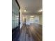 Inviting entrance with dark brown door, hardwood floors, and views into the dining room at 5928 Cobblestone Creek Cir, Mableton, GA 30126