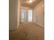 Upstairs hallway with neutral carpet and white doors at 5928 Cobblestone Creek Cir, Mableton, GA 30126