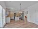 Open kitchen with stainless appliances, gray cabinets, center island, and easy access to the backyard at 5928 Cobblestone Creek Cir, Mableton, GA 30126