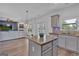 Open kitchen area with a center island, modern cabinets and countertops, and stainless steel appliances at 5928 Cobblestone Creek Cir, Mableton, GA 30126