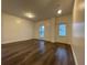 Open-concept living room with hardwood floors, neutral walls, and plenty of natural light at 5928 Cobblestone Creek Cir, Mableton, GA 30126