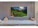 Modern living room featuring a large screen TV and custom shelving at 5928 Cobblestone Creek Cir, Mableton, GA 30126